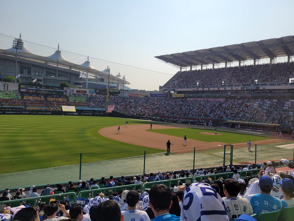 Watching baseball game at stadium